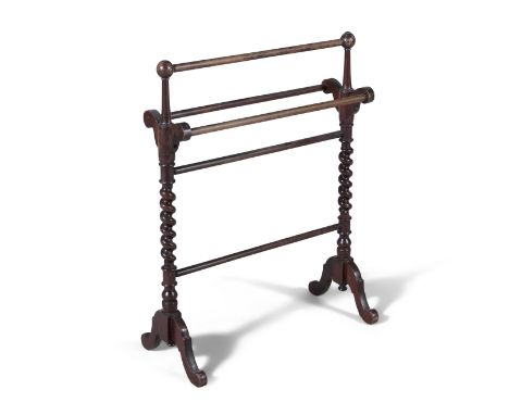 A VICTORIAN MAHOGANY TOWEL RAIL, with raised top rail above two lower rails, raised on bobbin turned supports joined by stret
