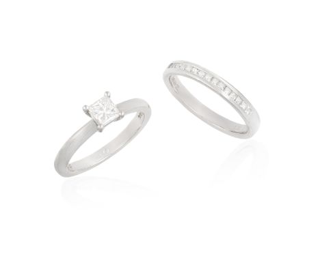  A DIAMOND RING AND A HALF HOOP ETERNITY RING, the solitaire ring set with a princess-cut diamond weighing approximately 0.45