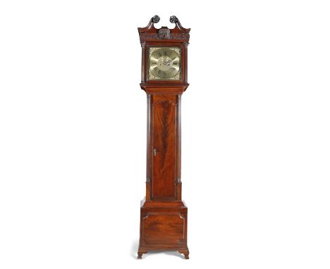 A GEORGE III IRISH CHIPPENDALE MAHOGANY LONGCASE CLOCK, the carved hood with broken pediment and disengaged pillars, enclosin