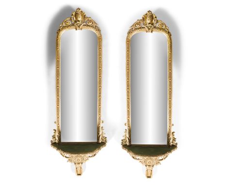 A PAIR OF VICTORIAN GILTWOOD AND GESSO PIER MIRRORS, c.1870, each with shaped rectangular plate, contained within narrow egg 