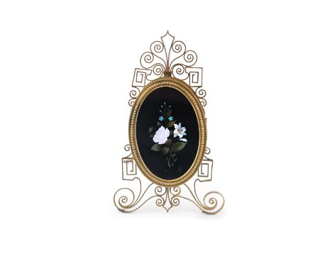 A PIETRA DURA OVAL PANEL, 19TH CENTURY, mounted on gilt metal easel back stand also enclosing a concealed erotic panel verso.