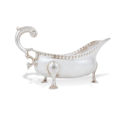 A LARGE AND HEAVY PROVINCIAL SILVER SAUCEBOAT, Cork c.1770, mark of John Nicolson, struck 'STERLING' to the underside, of hel