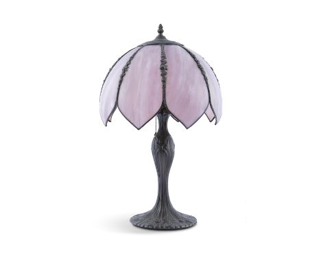 AN ART NOUVEAU STYLE BRONZED METAL TABLE LAMP, the circular baluster column of organic form raised on a cast spreading foot, 