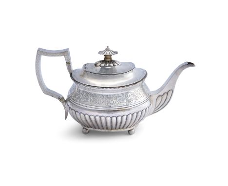 A REGENCY SILVER OVAL TEAPOT, London 1812, marker's mark rubbed, with pagoda finial and gadroon border, engraved foliate band