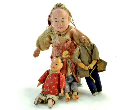 Group of interesting and vintage wooden / compositional asian dolls, one of missionary type. Generally fair to good.  Note: W