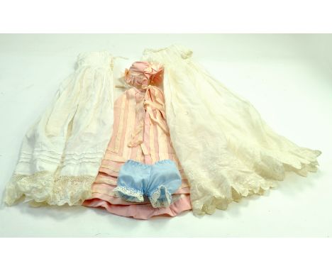 Vintage hand made dolls clothing comprising various garments.  Note: We are happy to provide additional images of any lot. Pl