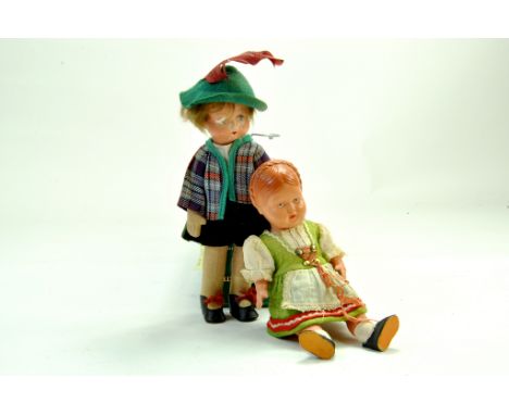 Duo of miniature german figure dolls. Well presented in period clothing. Generally Fair to Good.  Note: We are happy to provi