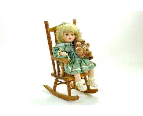 Alberon Porcelain Doll. Girl Sitting in Rocking Chair. Boxed and Complete. Excellent. Note: We are happy to provide additiona