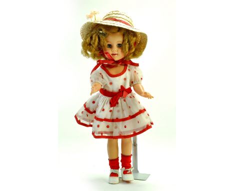 A beautiful 15” Vintage 1950’s Ideal Shirley Temple doll. Markings ST -15 -n. Vinyl doll wearing white and red polka dot dres