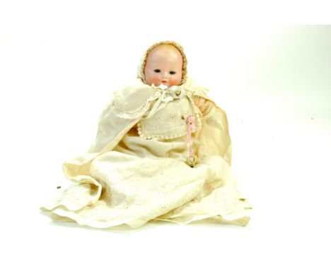 An antique 12" Herman Steiner Doll (marked) with googly eyes, closed smiling mouth on an all cloth jointed body. Herman Stein