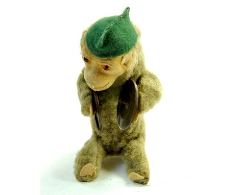 Marx 1950's 7" Wind Up Monkey Chimp playing Cymbals. Brass cymbals, Peach felt hands, feet, ears.  Orange plastic eyes, Green