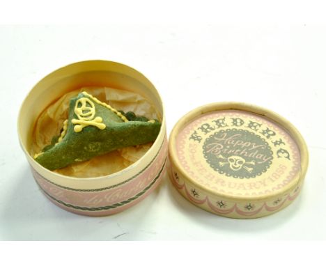 An extremely scarce example of a well preserved marzipan pirates hat and box, dated 1964, as designed by Peter Goffin. Backgr