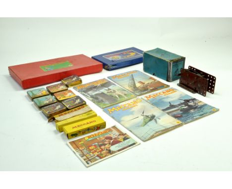 A selecton of Meccano vintage tins, empty plus other empty boxes and a boxed motor, plus literature. Generally good. Note: We