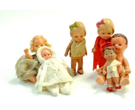 An interesting group of vintage doll issues. Including Kewpie examples and other miniature figures. Some wear hence, generall