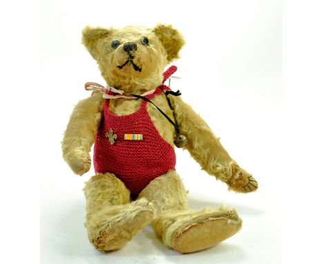 Vintage Large 16" Mohair Teddy Bear in knitted bathing costume with scouts badge. Large brass bell on black cord. Articulatin