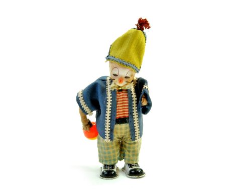 Vintage Mechanical tinplate clown , 8", Made in Japan. Fabric Dressed with Plastic Ball &amp; Hand Painted Plastic Head. 1950