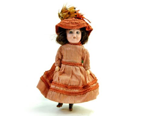 Antique Bisque Mignonette Doll Marked 15 on back of head. 9". Glass blue eyes, painted lashes, single stroke brows, open mout