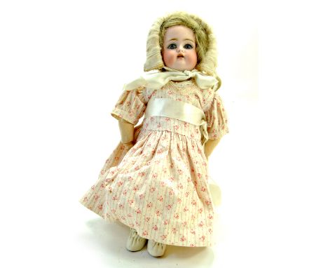 A 13” Kämmer &amp; Reinhardt Dollyface Child doll. Markings "K star R 34 Halbig". Biscuit porcelain-crank head with pierced e