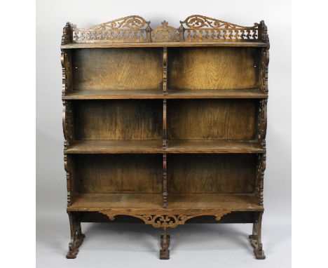 An Edwardian Carved and Pierced Oak Four Shelf Waterfall Bookcase with Galleried Top, 91cm wide and 111cm high 