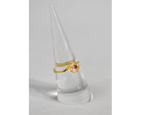 A Gold Ring with Central Ruby Flanked by Two White Stone, 2g, Size N 