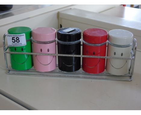 SMILEY FACE SPICE JARS ON SHELF