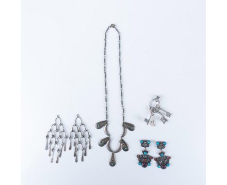 Features an assortment of Silver pieces with incrusted stones and intricate designs. Total weight: 40g. Marked 925. Largest p