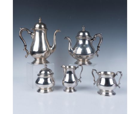 Gorgeous sterling silver tea set, includes: One Tea pot, with a capacity of 10 cups; One Coffee pot with a capacity for 9 cup
