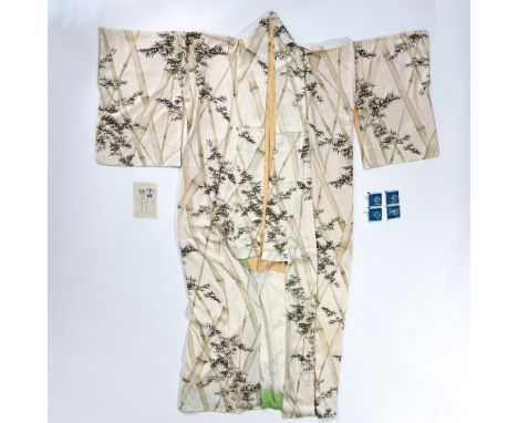 A yellowish breathable silk robe decorated with a printed bamboo pattern. Known as a yukata, this summer kimono is designed f