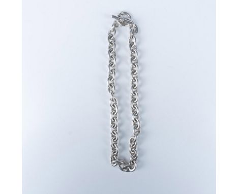 A luxurious sterling silver toggle necklace with 9 small faceted diamonds. Marked Anne Slane 925. Measures 18"L. Weighs 150g.