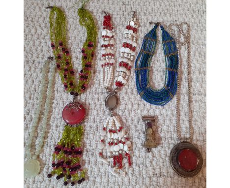 Worldwide vintage jewellery to include an Afghani white metal and carved red agate pendant on a white metal chain, silver ite