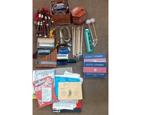 A quantity of vintage percussion instruments and others to include a Hohner Chromonica, a Super Chromonica, a Parrot Harmonic