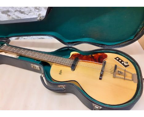 A late 1950's Hofner Club 50 electric guitar in laminated maple having an arched top, a 3 switch control panel introduced in 