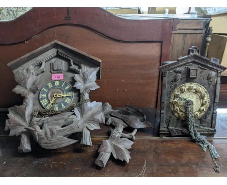 A Swiss Black Forest cased cuckoo clock, and a Bakelite cased wall hanging cuckoo clock Location: 