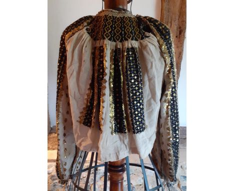 An early 20th Century Mediterranean light brown linen blouse with elaborate black and gold sequin design with black and gold 