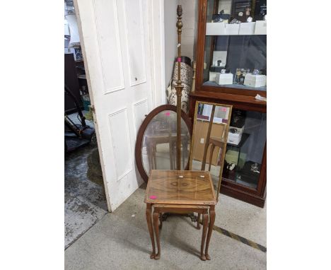 A mixed lot to include two wall mirrors, a gilt metal and brass extending standard lamp, a walnut nest of two tables with ins