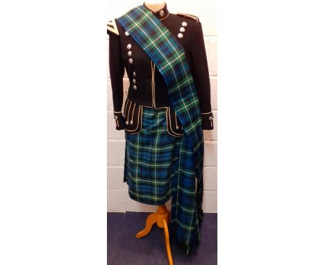 A green and blue tartan ladies kilt together with a Scottish Macleod black military style Royal British Legion piper's double