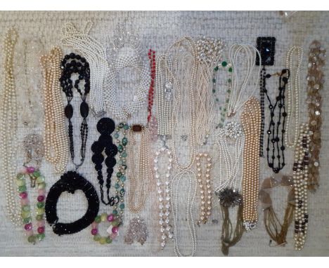 A quantity of vintage bead and faux pearl necklaces to include Aurora Borealis examples and faux black jet together with a mo
