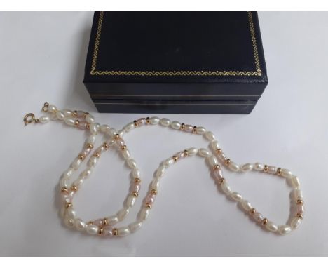 A 9ct gold with pink and white seed pearl necklace. Location:Cab 