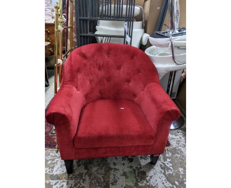 A contemporary button back red upholstered armchairLocation: 
