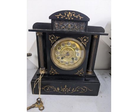 A Victorian black slate 8-day mantel clock Location: 