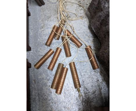A mid 20th century Scandinavian style pendant ceiling light, ten copper cylinder shades on pendant wiresLocation: 