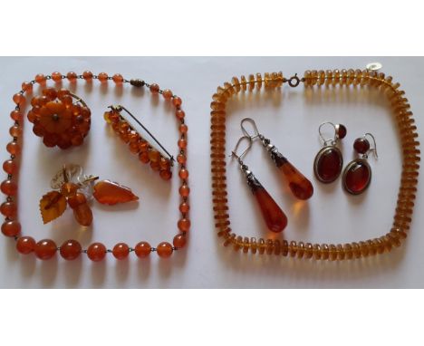A quantity of vintage amber and amber coloured jewellery A/F to include 2 pairs of amber earrings. Location:BWR 