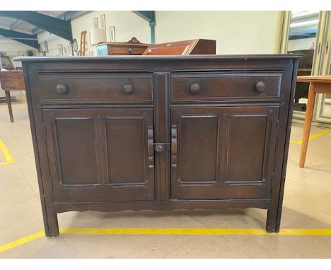 Ercol mid 20th century dark elm dresser, two cupboards with two drawers above approximately 120 x 48 x 84cm