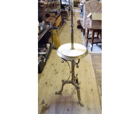 A late Victorian brass and onyx adjustable standard lamp, on a tripod base

 