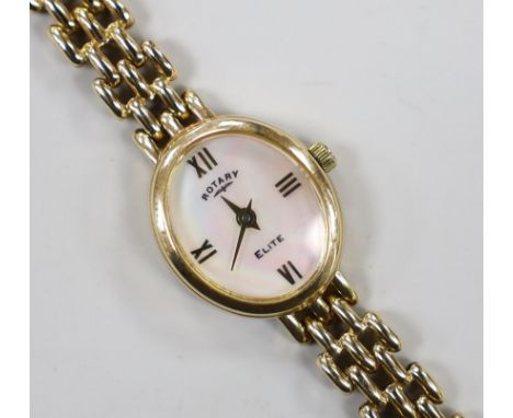 A lady's modern 9k Rotary Elite oval dial quartz wrist watch, on a 375 bracelet, overall 18cm, gross 15.4 grams.