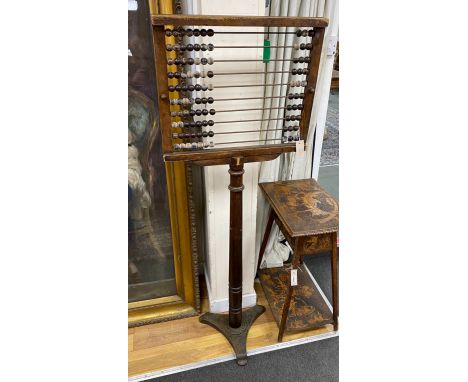 An early 20th century Educational Supply Co. beech classroom abacus on cast iron triangular platform, height 153cm