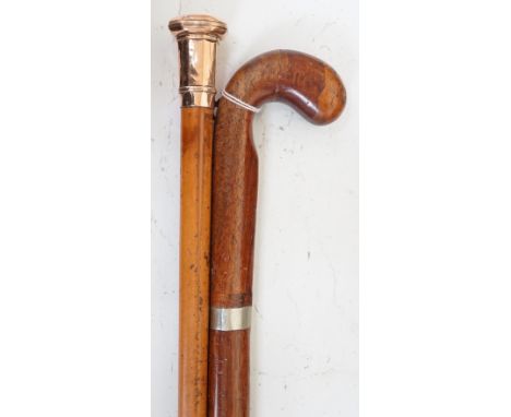 A yellow metal overlay topped walking stick, 91cms long and another (2)