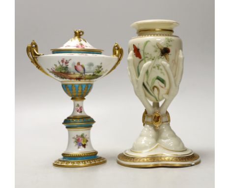 A Royal Worcester urn, modelled as three birds legs holding an oviform vase and a Royal Crown Derby two handled urn and cover