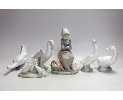 A Lladro seated girl with ducks and five Nao ducks
