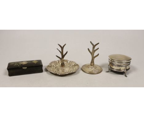 Two early 20th century silver ring stands, tallest 7cm, a small silver mounted trinket box and a 19th century inlaid wooden s